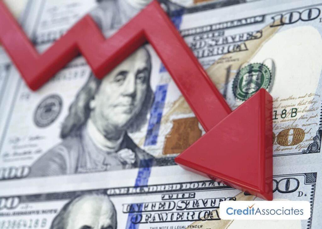 Money with a declining arrow.