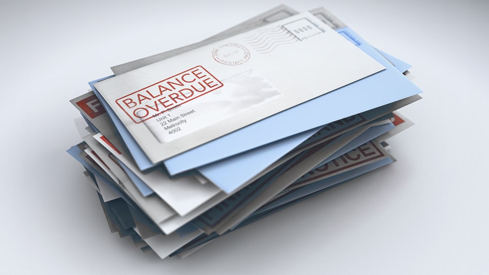 Overdue bills and envelopes.