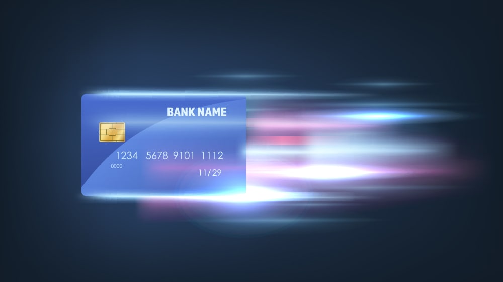 Credit card moving fast with light showing speed coming off of it.
