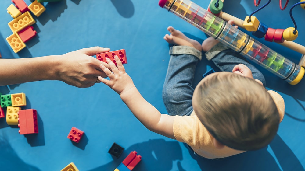A kid playing at a daycare.