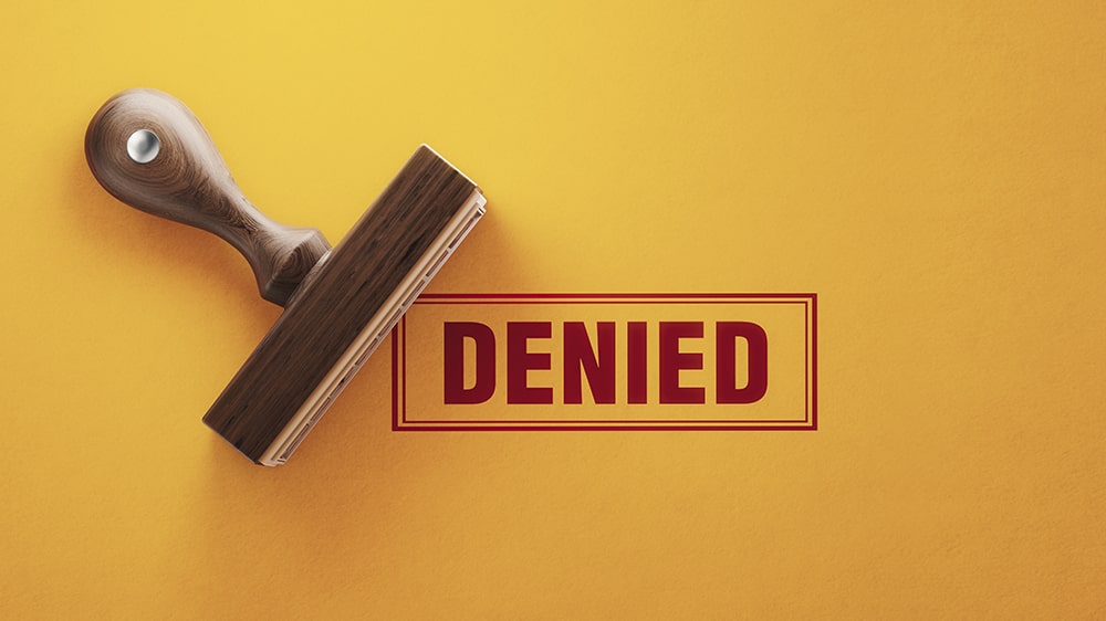 A "DENIED" stamp.