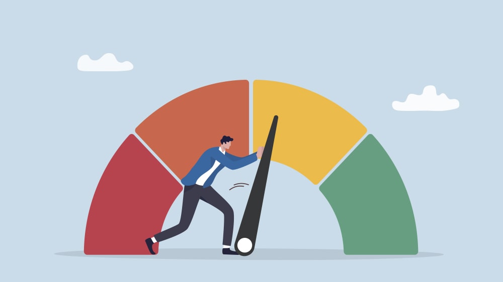 A person pushing the scale from red to green representing building a string credit score.